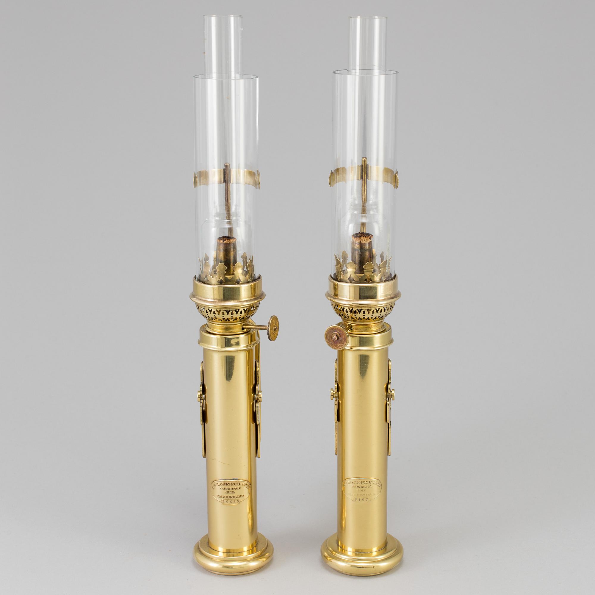 A pair of brass kerosene lamps, GV Harnisch Eftr, Copenhagen, 20th century.
