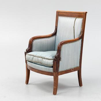 An Empire style mahogany easy chair, early 19th Century.