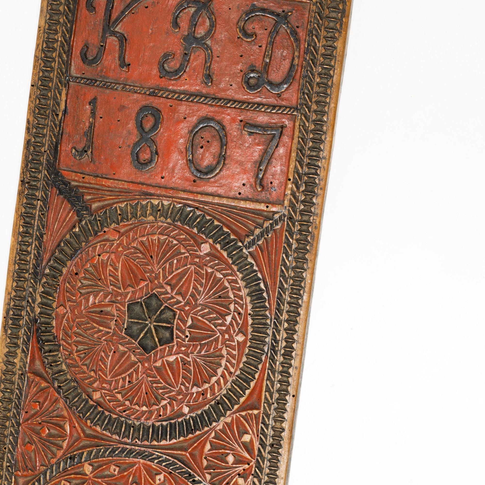 A painted wooden mangle board, Southern Sweden, dated 1807.