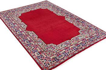 An old Kerman carpet, signed, c. 290 x 208 cm.