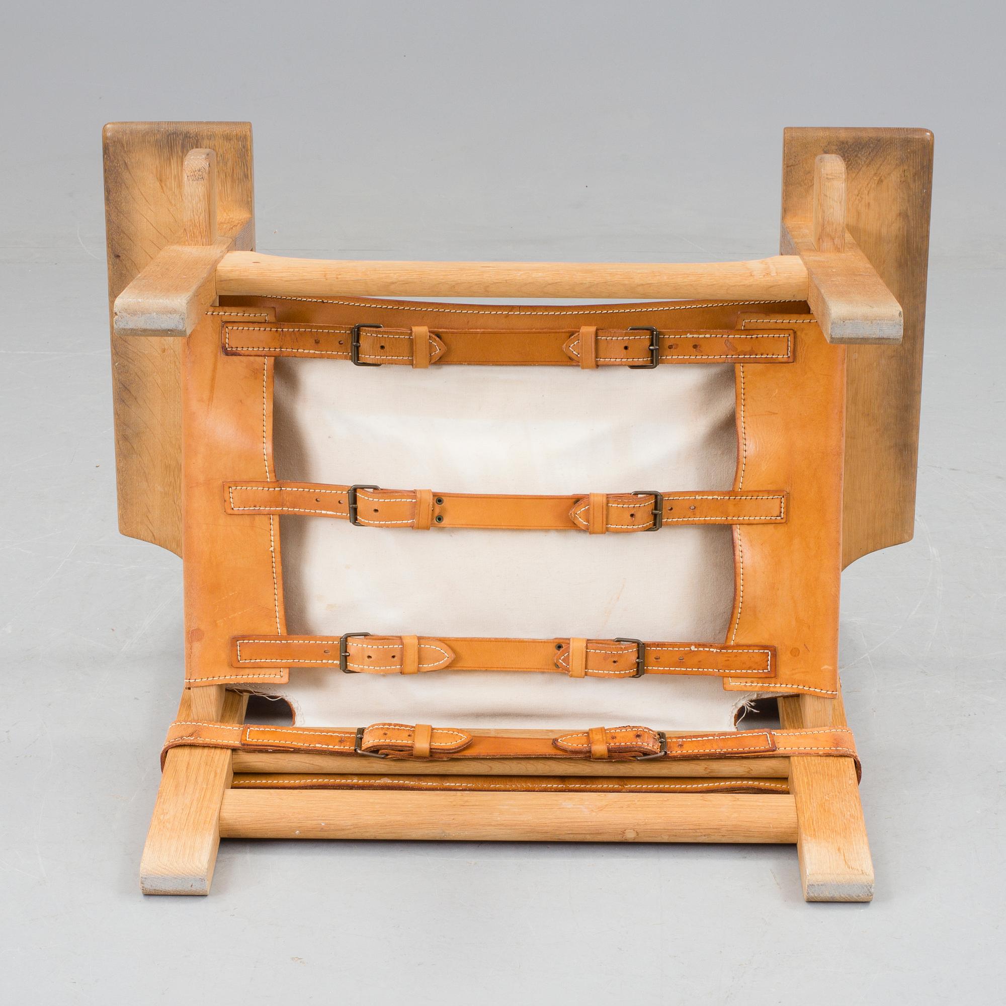 A Børge Mogensen oak and leather 'Spanish Chair' by Fredericia Stolefabrik, Denmark.