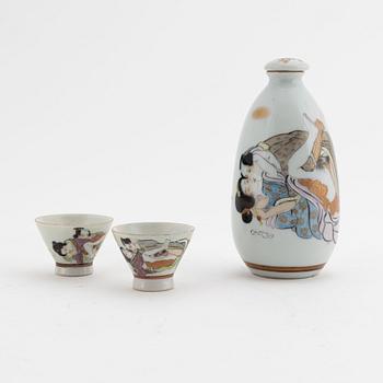 A Japanese porcelain sake flask and a pair of cups, 20th Century.