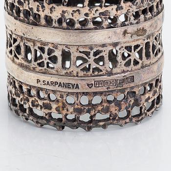 Pentti Sarpaneva, a 12-piece set of 'Pitsi' (lace) silver napkin rings, Turun Hopea, Turku 1982.