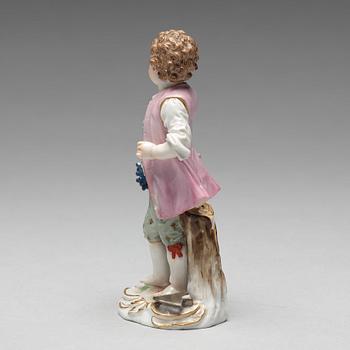 A Meissen figure of a young boy with grapes, 1890's.