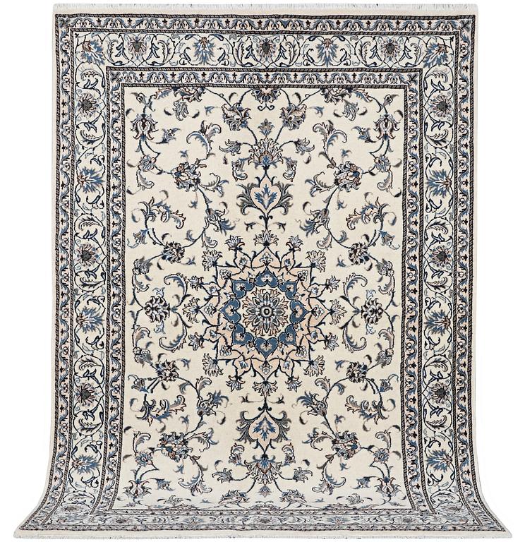 A Nain rug, part silk, c. 241 x 164 cm.