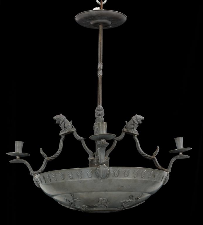 A pewter chandelier, in parts attributed to Anna Petrus, for four candles executed by Firma Svenskt Tenn in 1927.