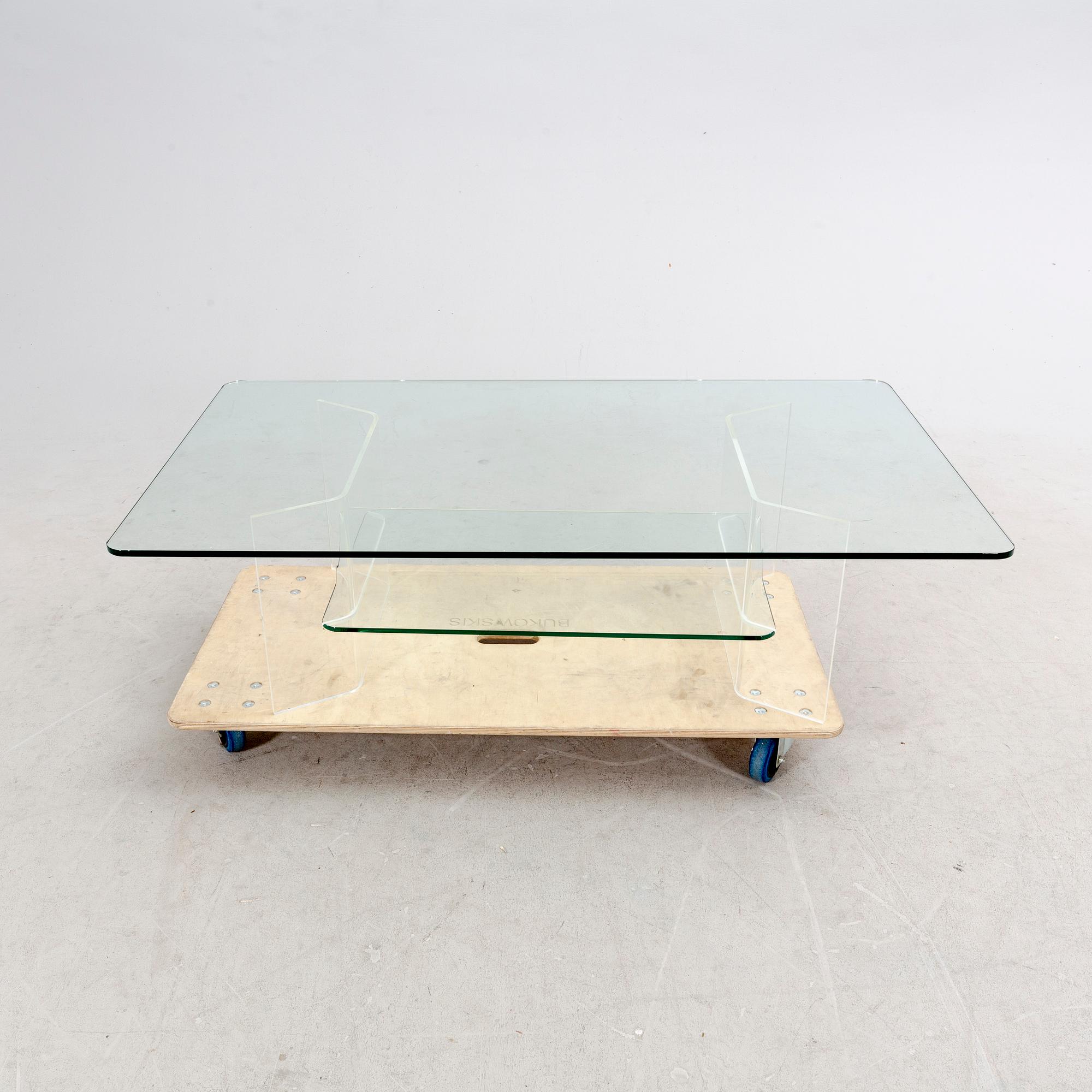 A late 20th century glass and plexi coffee table.