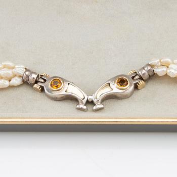 Tonino Lamborghini, Necklace of cultured pearls with a pendant of 18K gold, silver, and faceted citrines.
