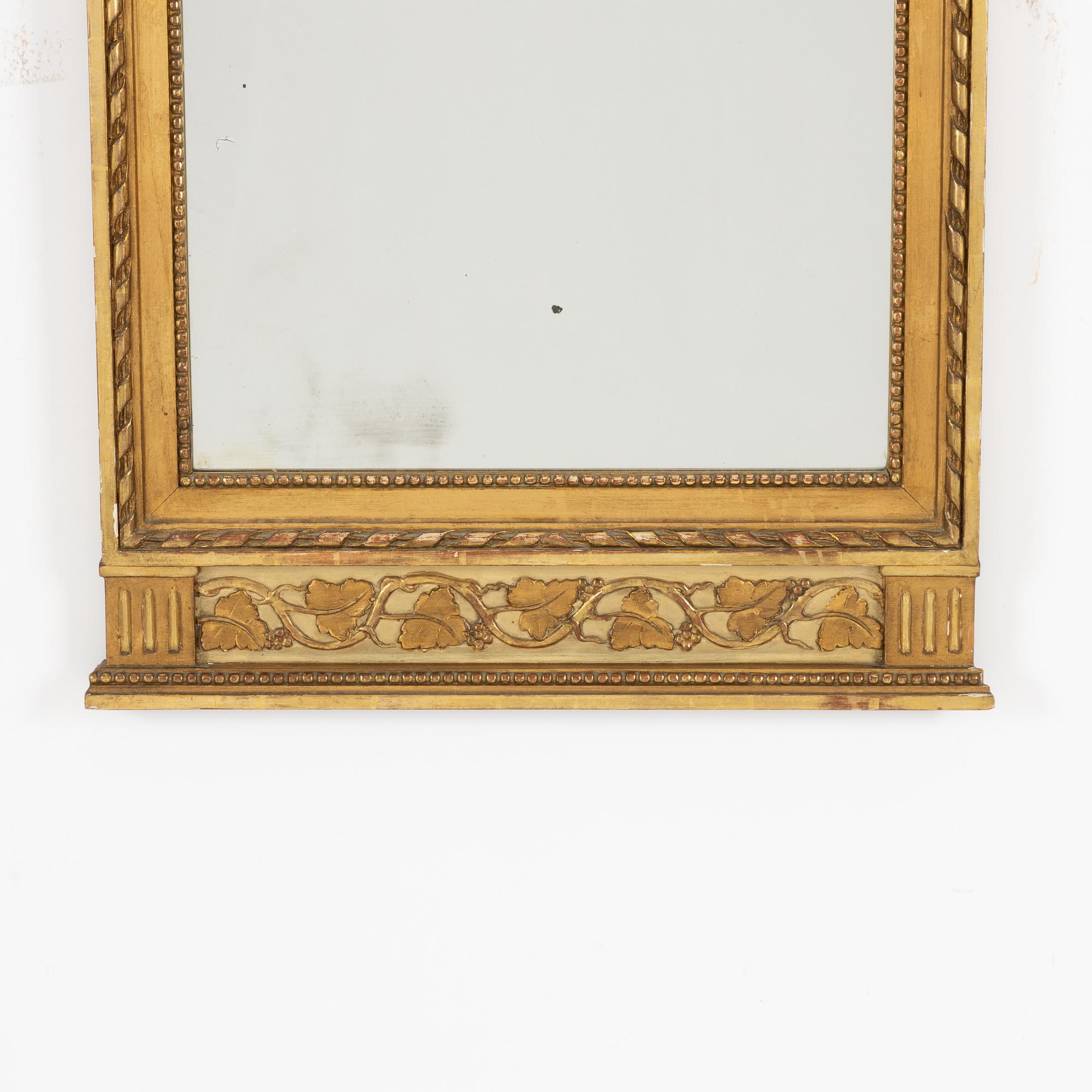 A Gustavian style mirror, circa 1900.