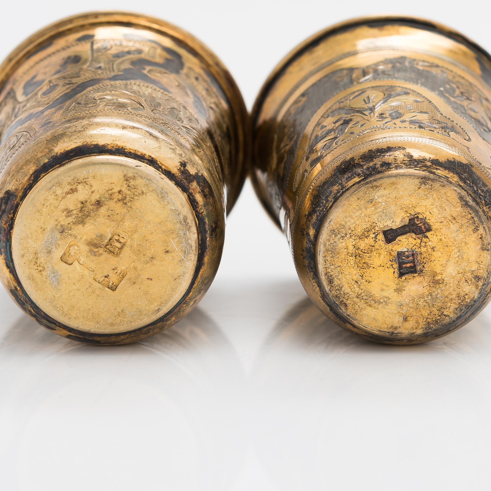 Four parcel-gilt silver beakers, Moscow 1870, 1876 and 1890.