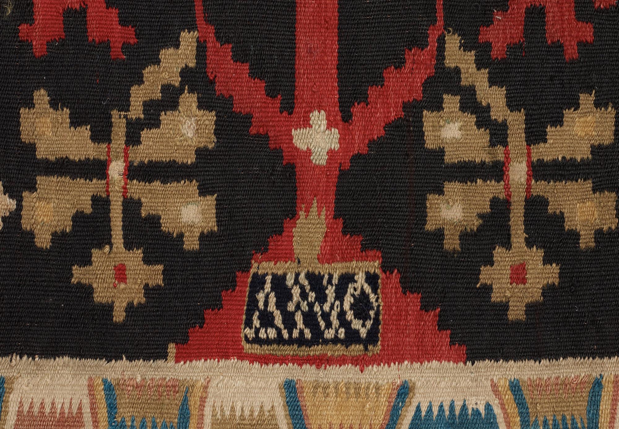 CARRIAGE CUSHION. Rölakan (flat weave). 51,5 x 114 cm. Skåne, Skytts härad (district), dated 1819.