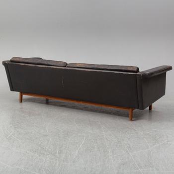 A black leather 1960s-70s sofa by Karl Erik Ekselius.