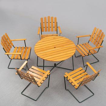 A set of five chairs and a table, Grythyttan, manufactured between 1954 and 1962.