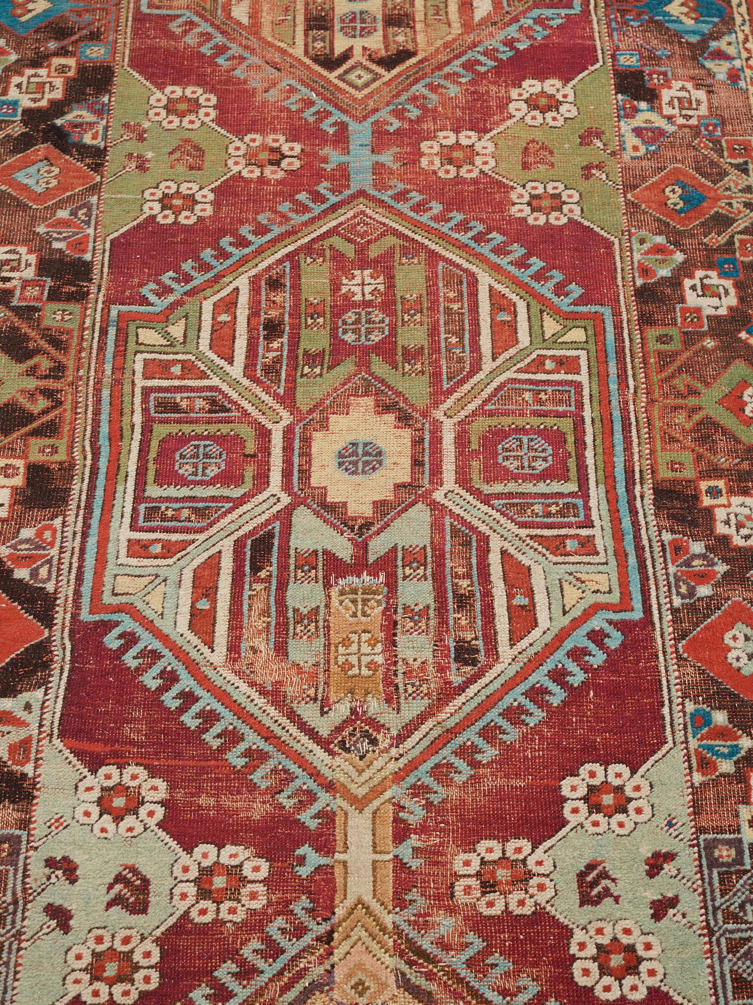 MATTO, an antique Anatolian, ca 425 x 101-107 cm (as well as 2,5 cm light green flat weave at one end.