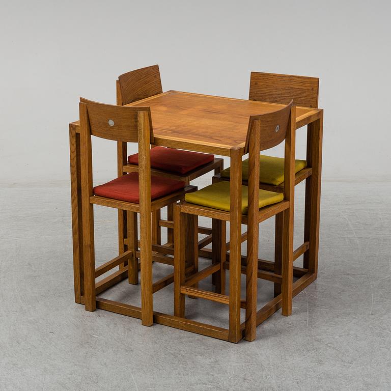 MARIO PRANDINA, an oak table and four chairs, Plinio Il Giovane, Italy.