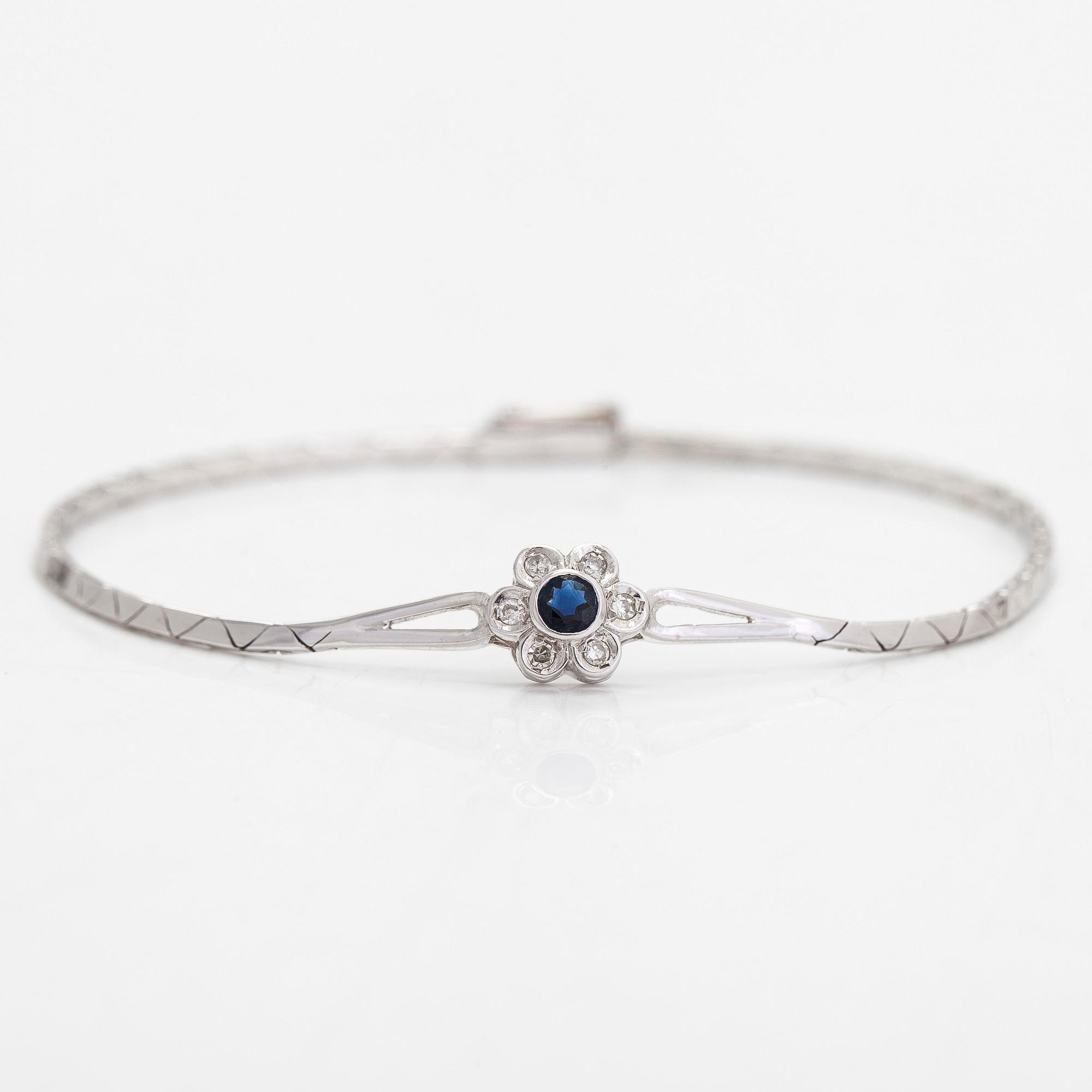 Rannekoru, 14K kultaa safiiri ja timantteja yht. n. 0.12ct. Tuontileimattu Westerback.
