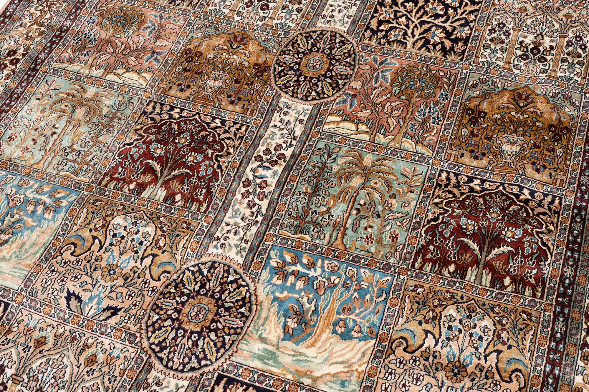 An oriental silk carpet, c. 305 x 205 cm.