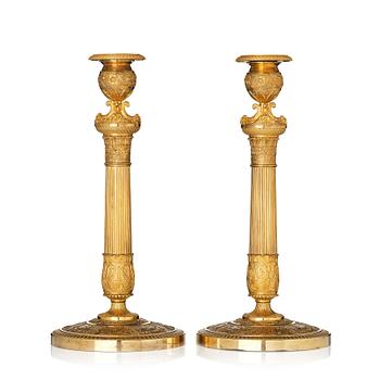 143. A pair of French Empire candlesticks, early 19th century.