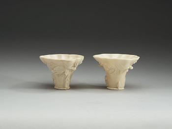 A set of two blanc de chine libation cups, Qing dynasty.