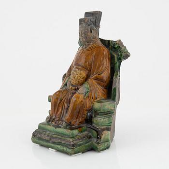 A ceramic sculpture of a seated daoist dignitary, Ming dynasty, (1368-1644).