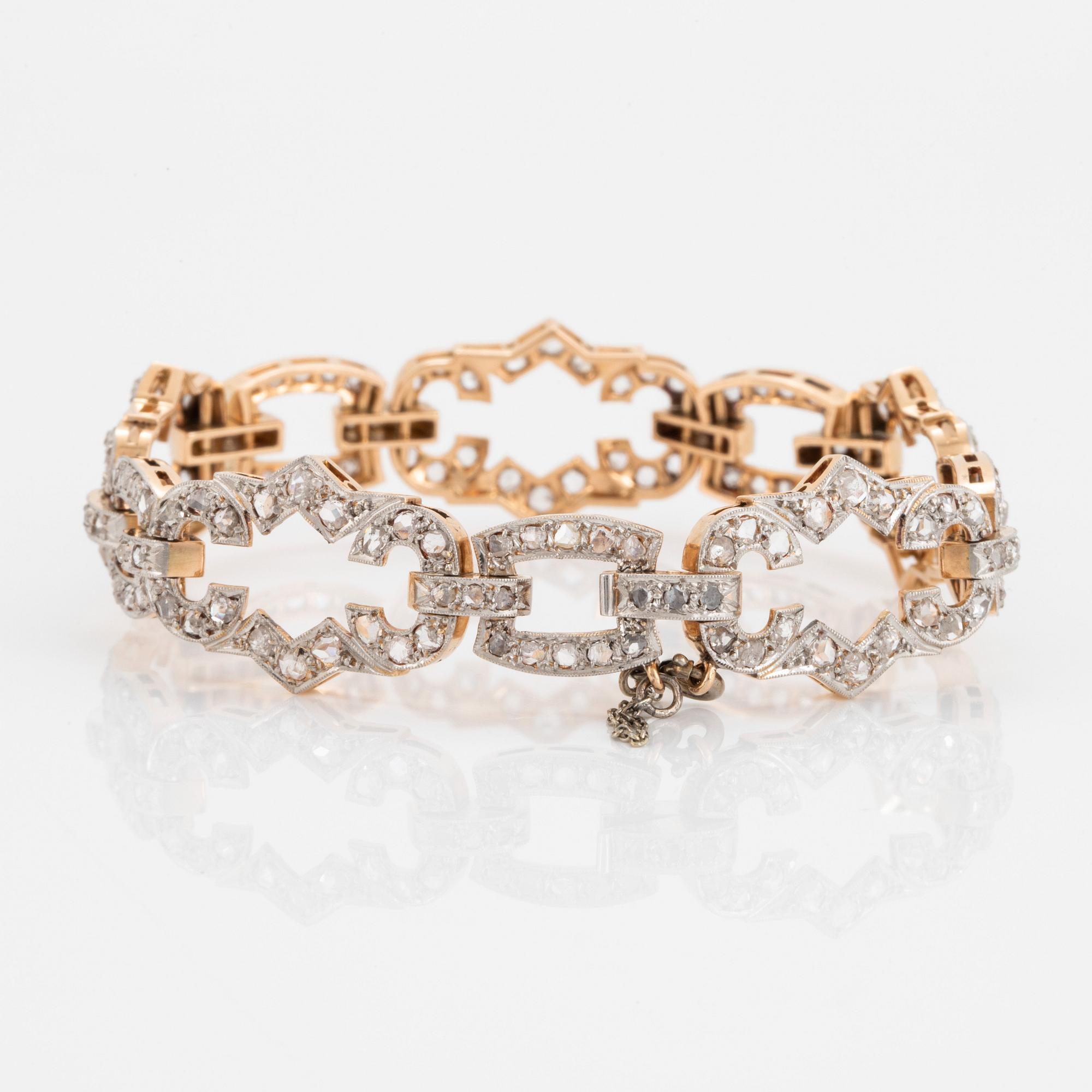 A 14K gold and platinum bracelet set with rose-cut diamonds.