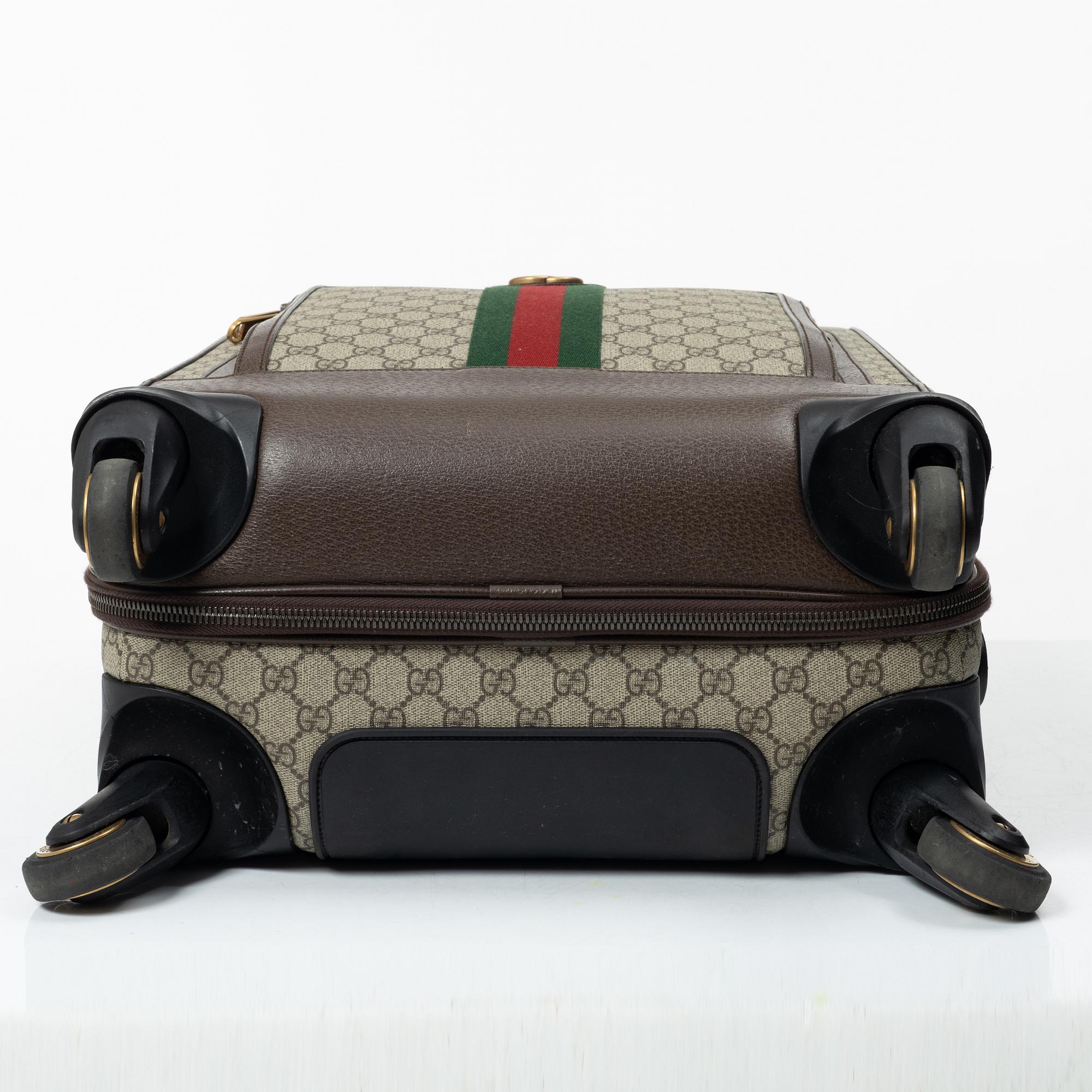 Gucci, suitcase / cabin bag.