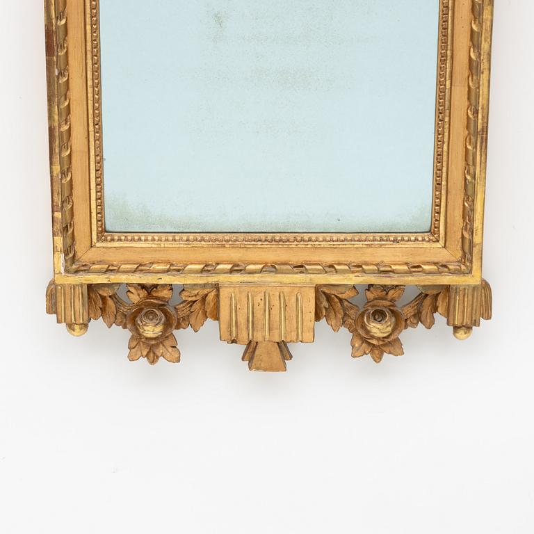 A Gustavian giltwood mirror by L. Lundén (master in Stockholm 1773-1819).