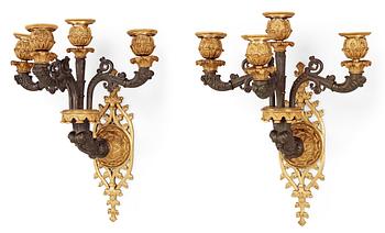 A pair of Neo-Gothic mid 19th Century four-light wall-lights.