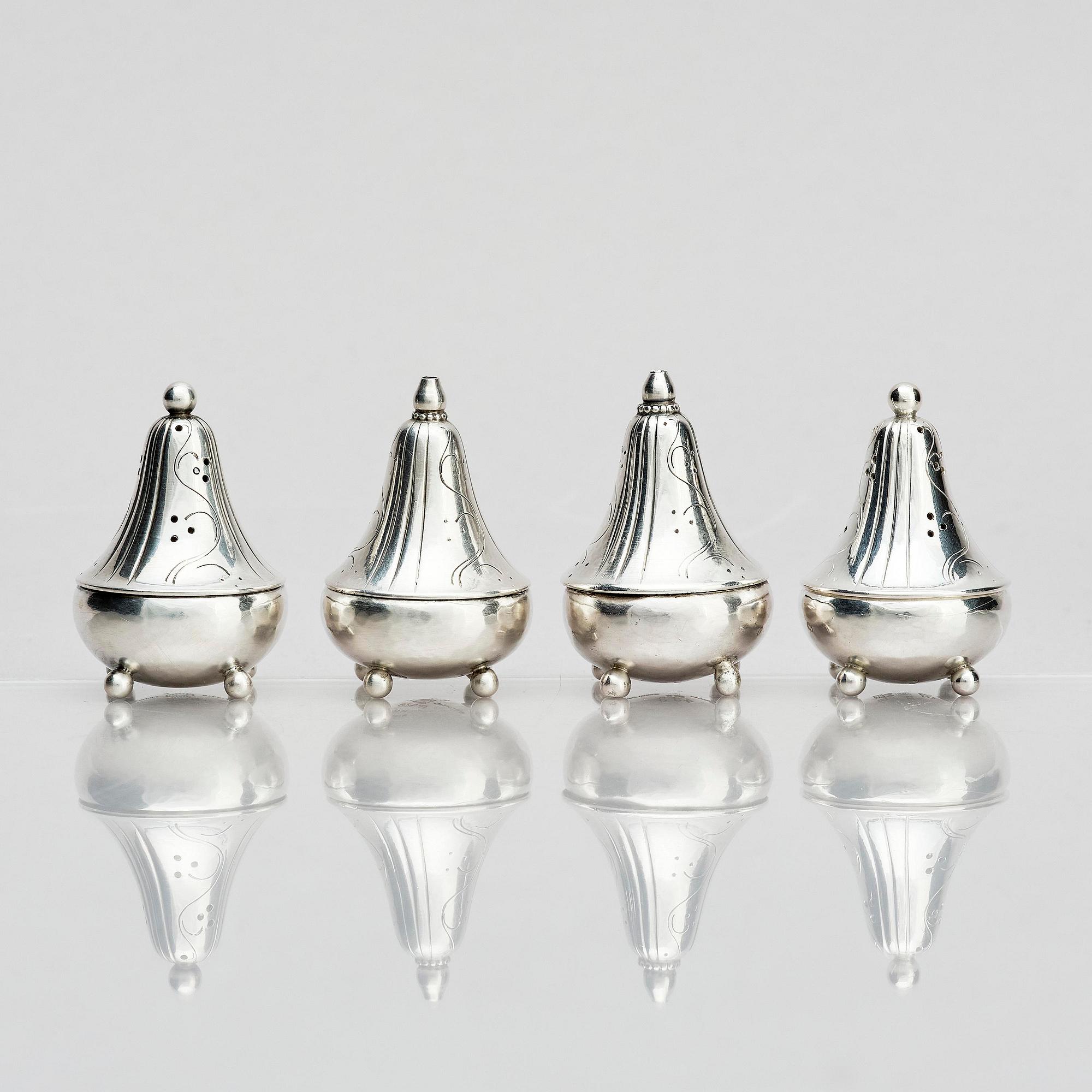Georg Jensen, four sterling silver casters, design Harald Nilesen, Copenhagen 1933-44, one Copenhagen after 1945.