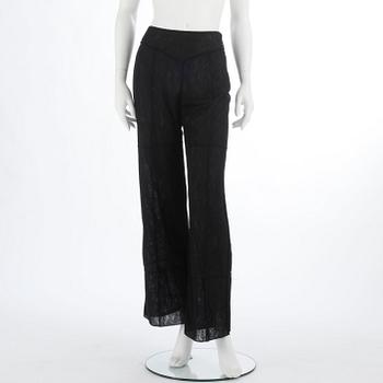 CHANEL, a black mesh evening pant.