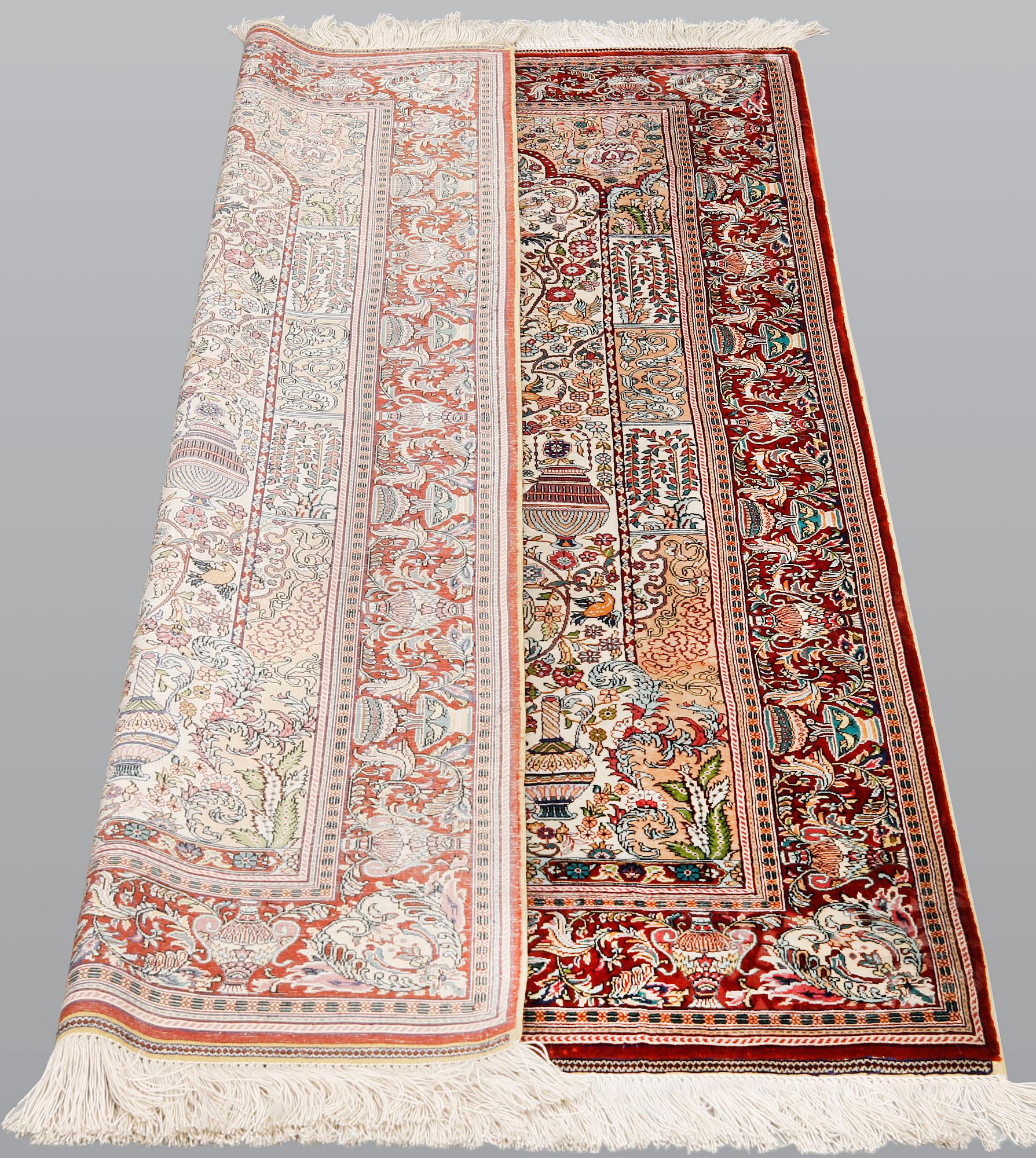 A oriental silk rug, 155 x 93 cm.