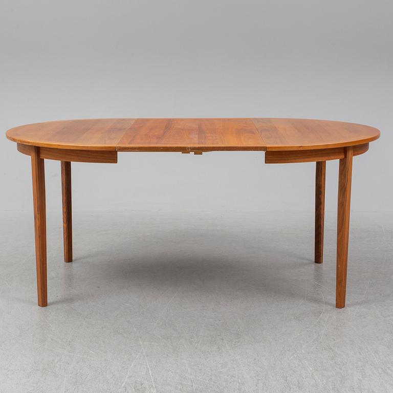A 1950/60s teak and valnut table and four chairs.