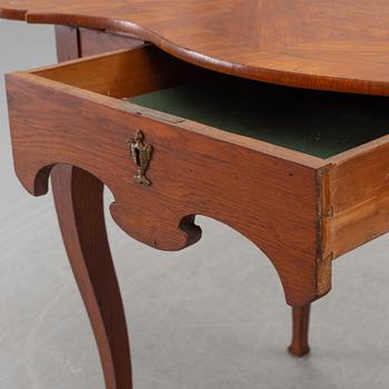 A composite rococo style writing desk.