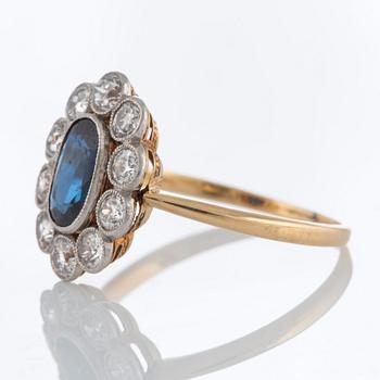 A sapphire ring in platinum and 18K gold set with old-cut diamonds.