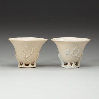 A pair of blanc de chine libation cups, Qing dynasty 18th century.