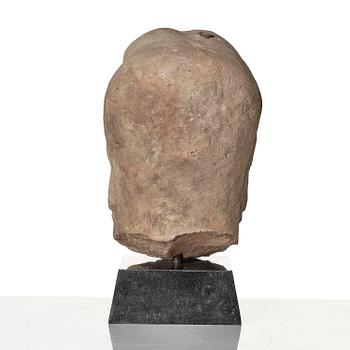A sanstone sculpture of a Luohan, Yuanstyle.