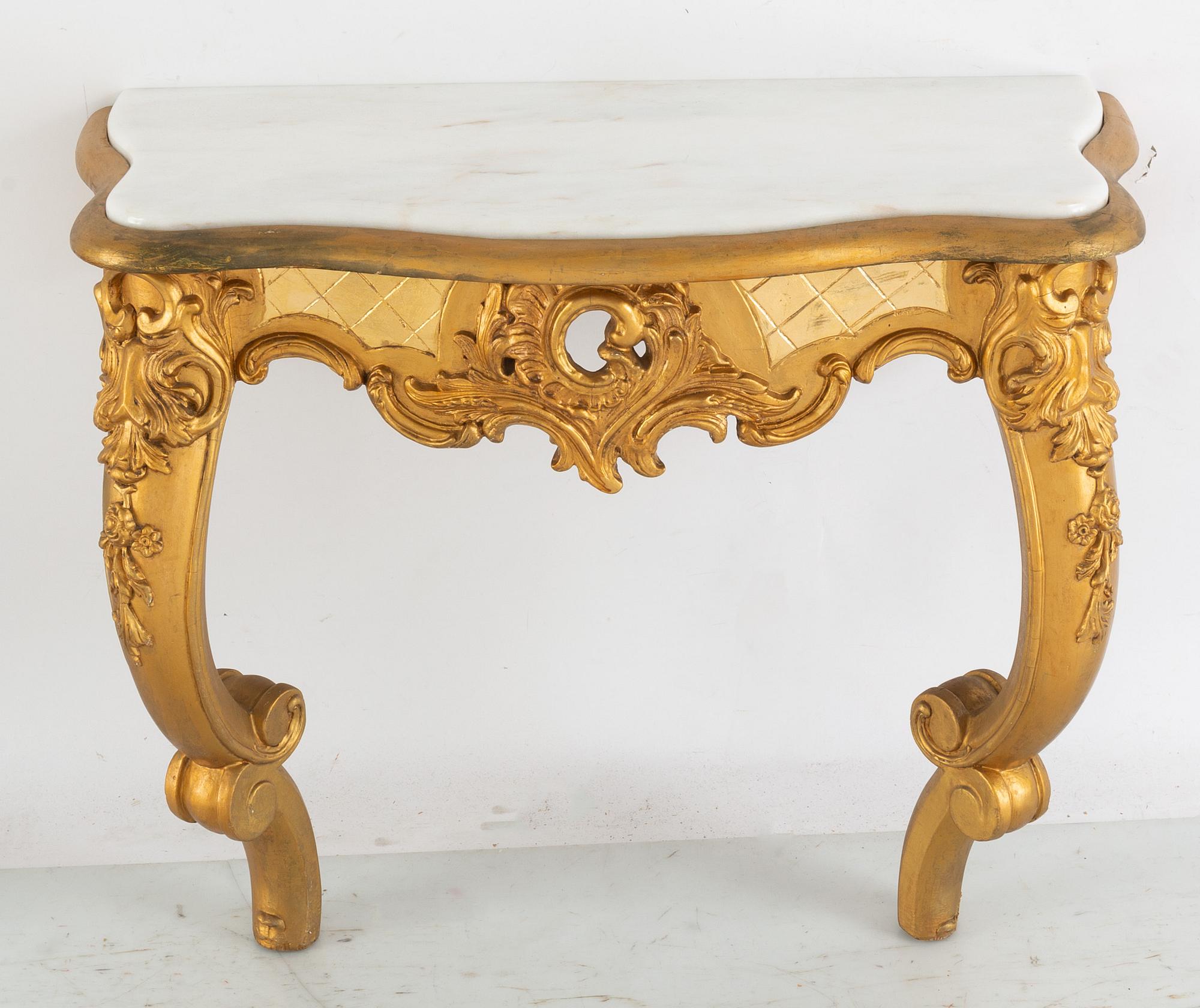 A 20th Century rococo style mirror with a console table. - Bukowskis