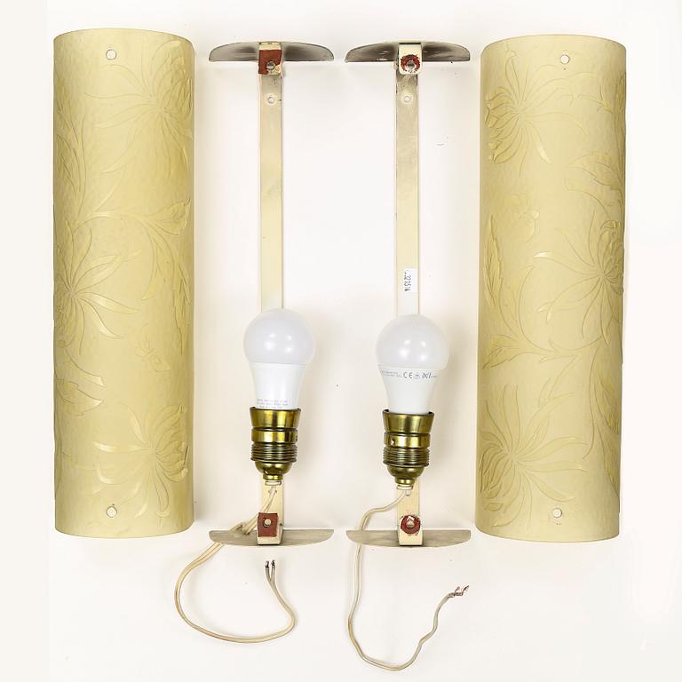 A pair of 1940s glass and metal wall lights.