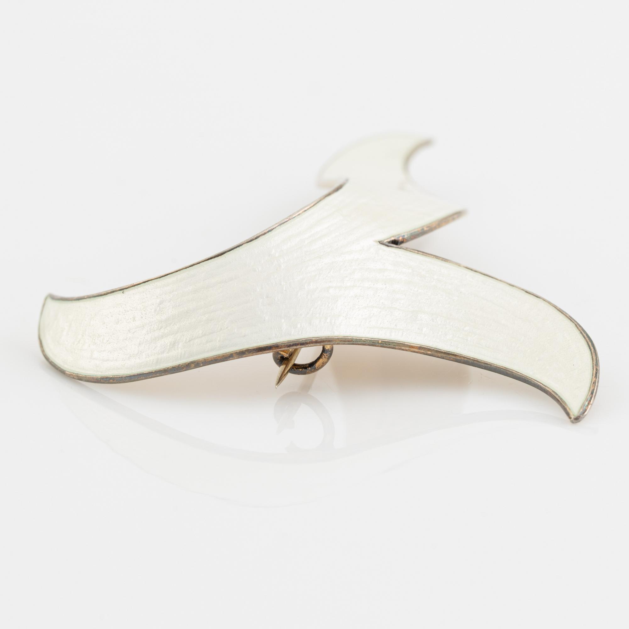 Brooch and a pair of earrings, sterling silver and white enamel. Norway.