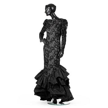 RENÉE LANGE, a black evening dress.