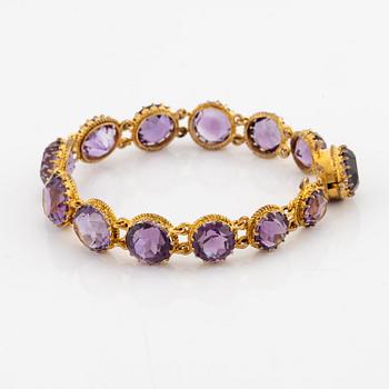 A necklace and a bracelet of gilded silver with faceted amethysts.