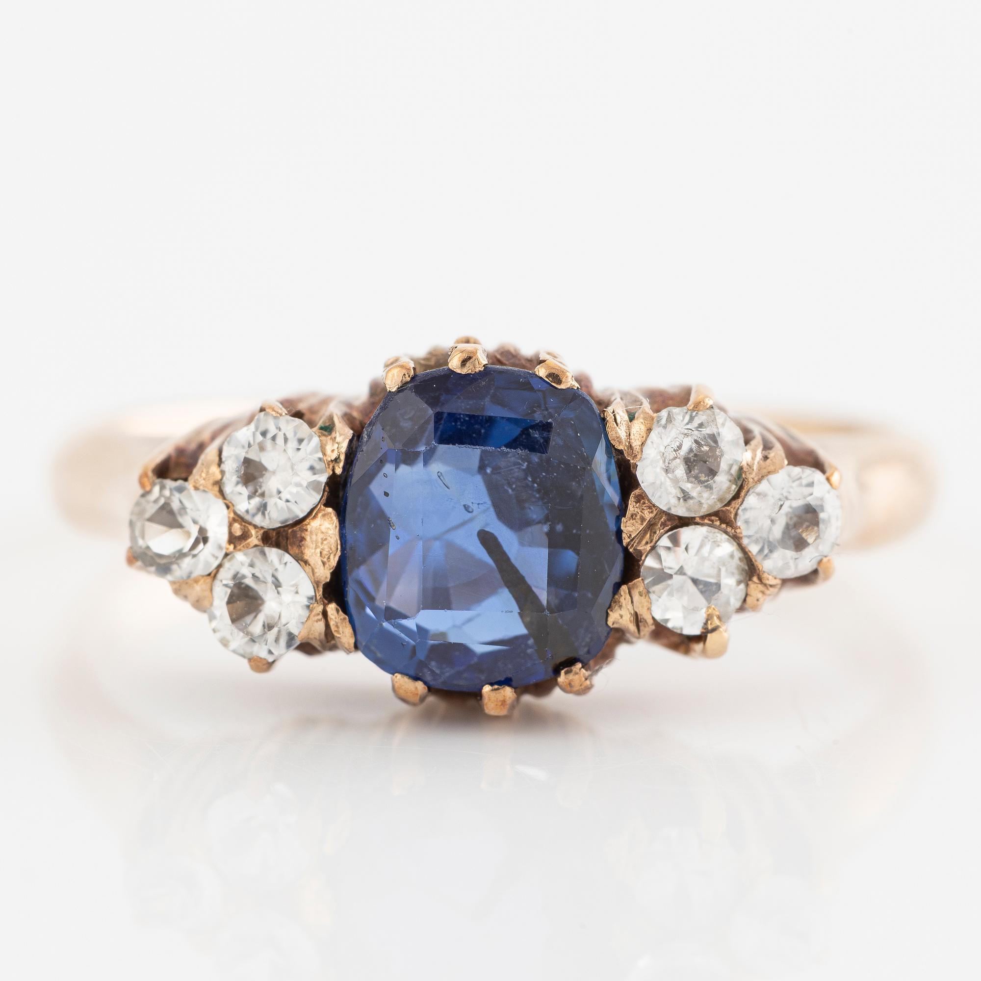Ring, 14K gold with blue sapphire and white stones.
