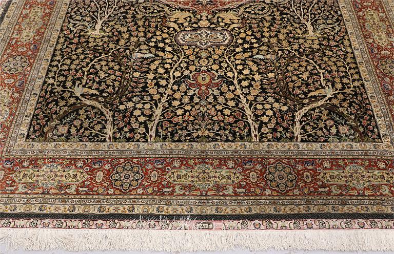 A oriental silk carpet, 303 x 201 cm.