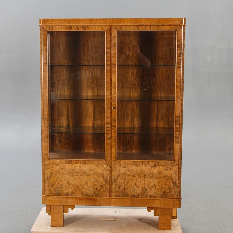 A walnut 1930740s display cabinet.