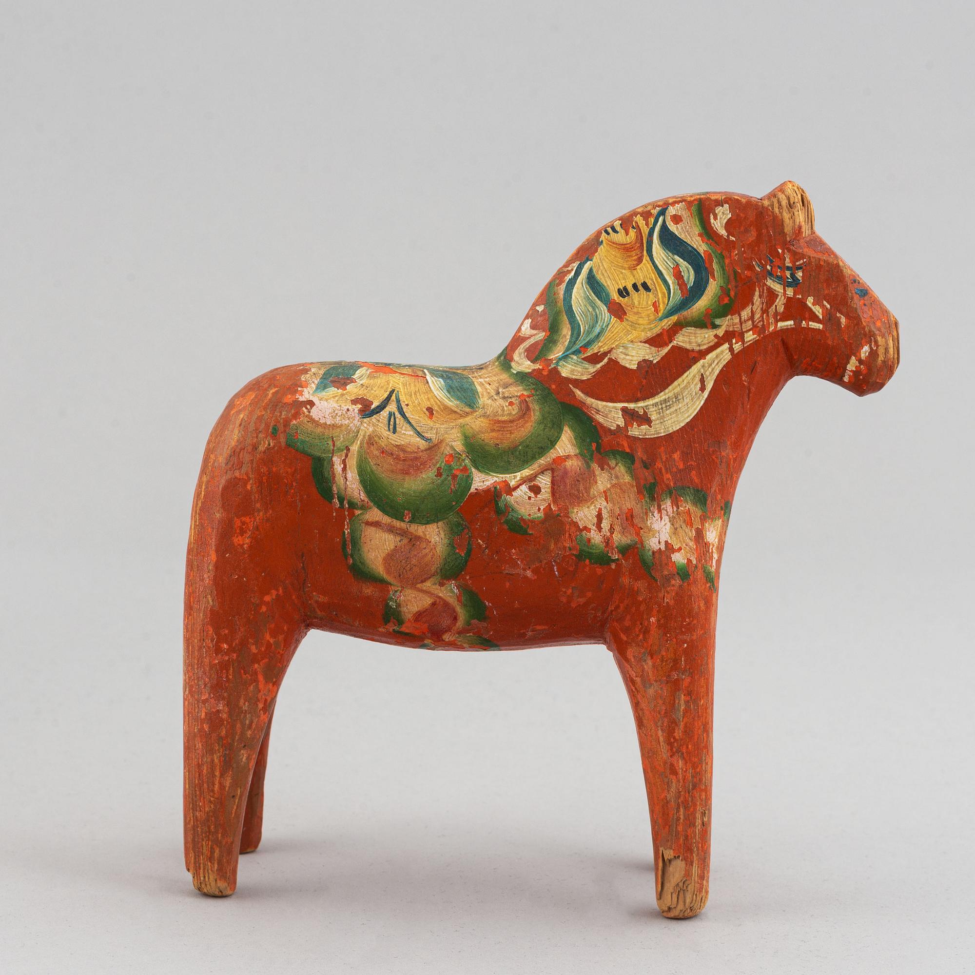 A set of 4 painted wooden horses from the first half of the 20th century.