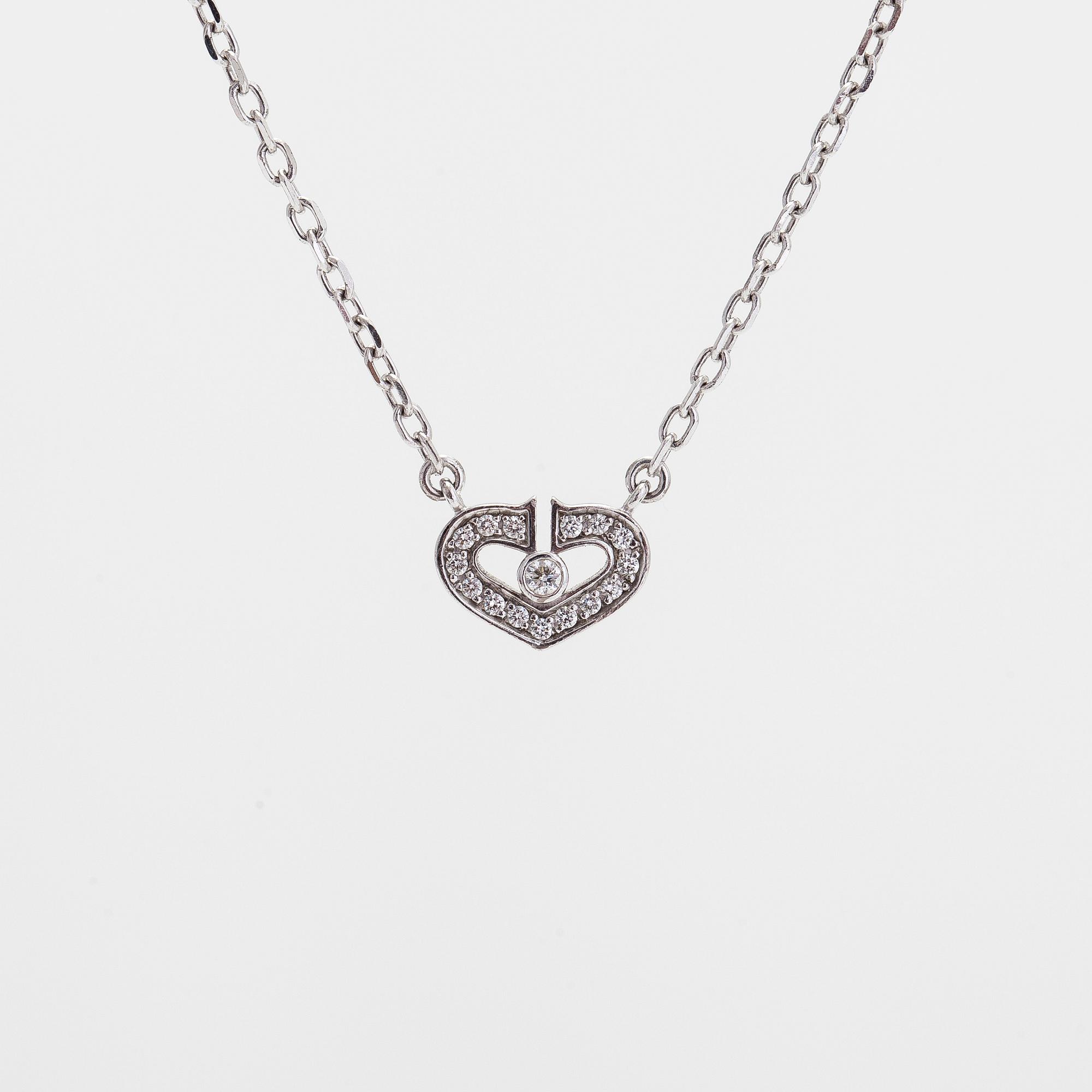 Cartier, an 18K white gold 'C Heart of Cartier' necklace with diamonds approx. 0.09 ct in total.