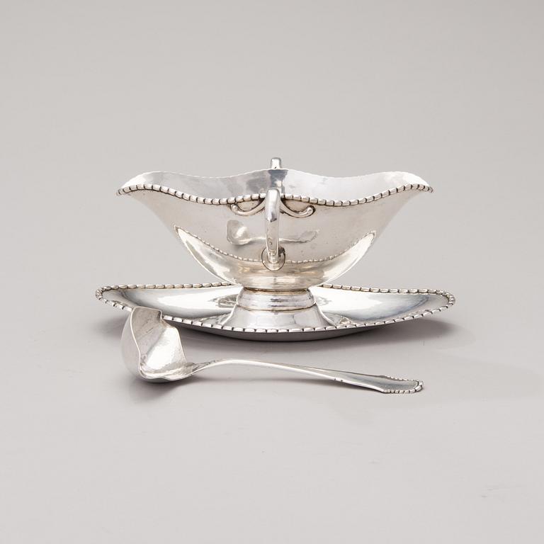 A sauce boat with a sauce ladle in silver, mark of Paul Bang, Copenhagen, Denmark 1929 and 1930s.