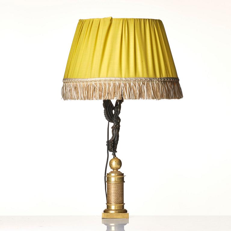 A French Empire ormolu and patinated bronze table lamp, early 19th century.