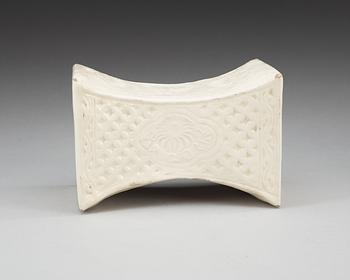 A cream glazed pillow, Song/Jind dynasty. With seal marks of a family and a date to the short sides.