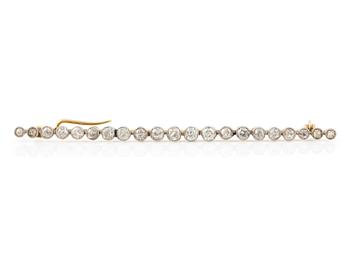 540. A brooch/pendant, pin, gold and platinum set with old-cut diamonds.